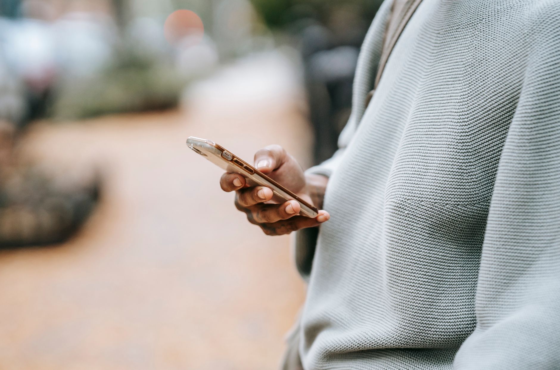SMS marketing strategy for D2C brands in India - person using mobile phone