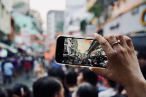 Person recording short-form video on smartphone for D2C brand marketing