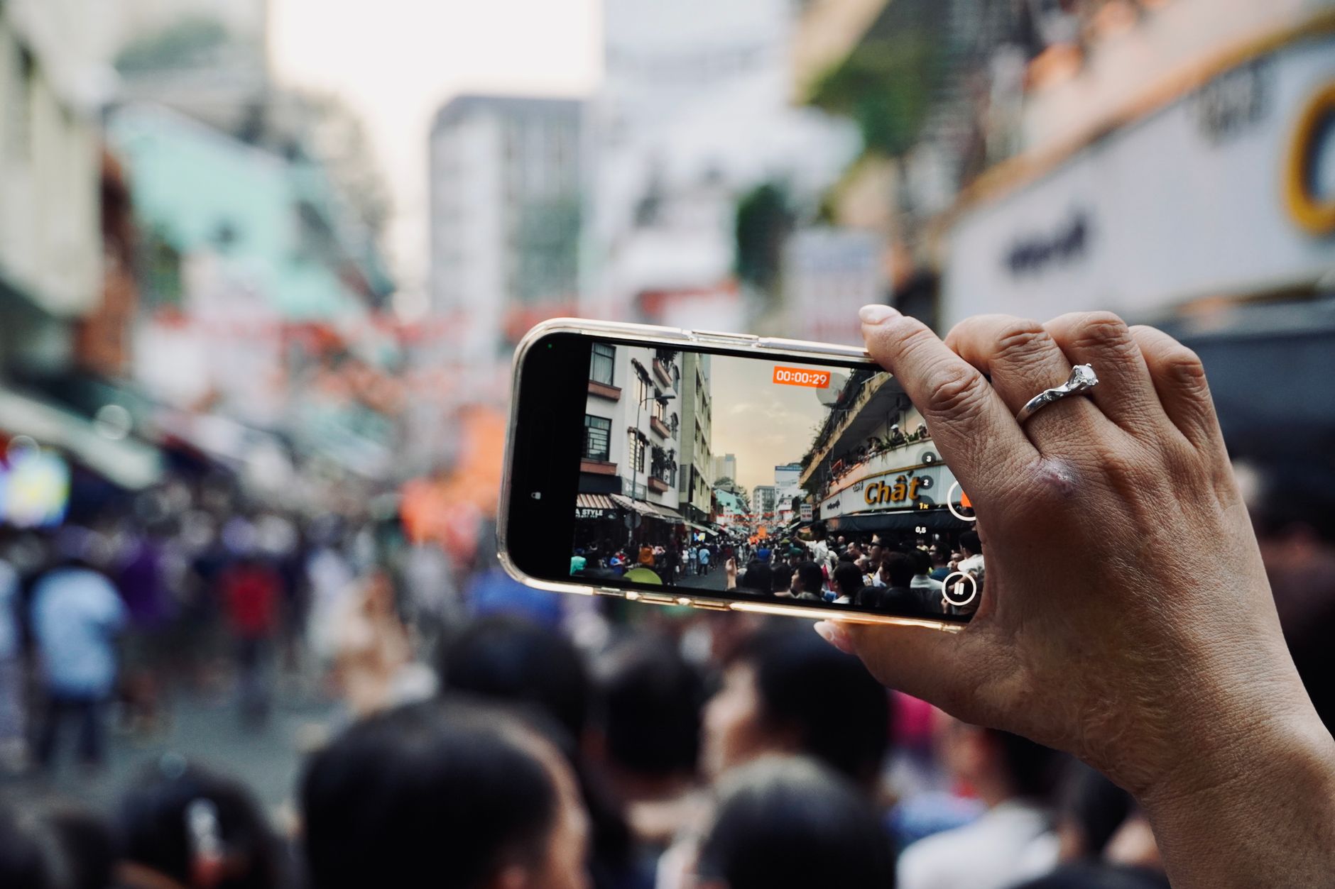 Person recording short-form video on smartphone for D2C brand marketing