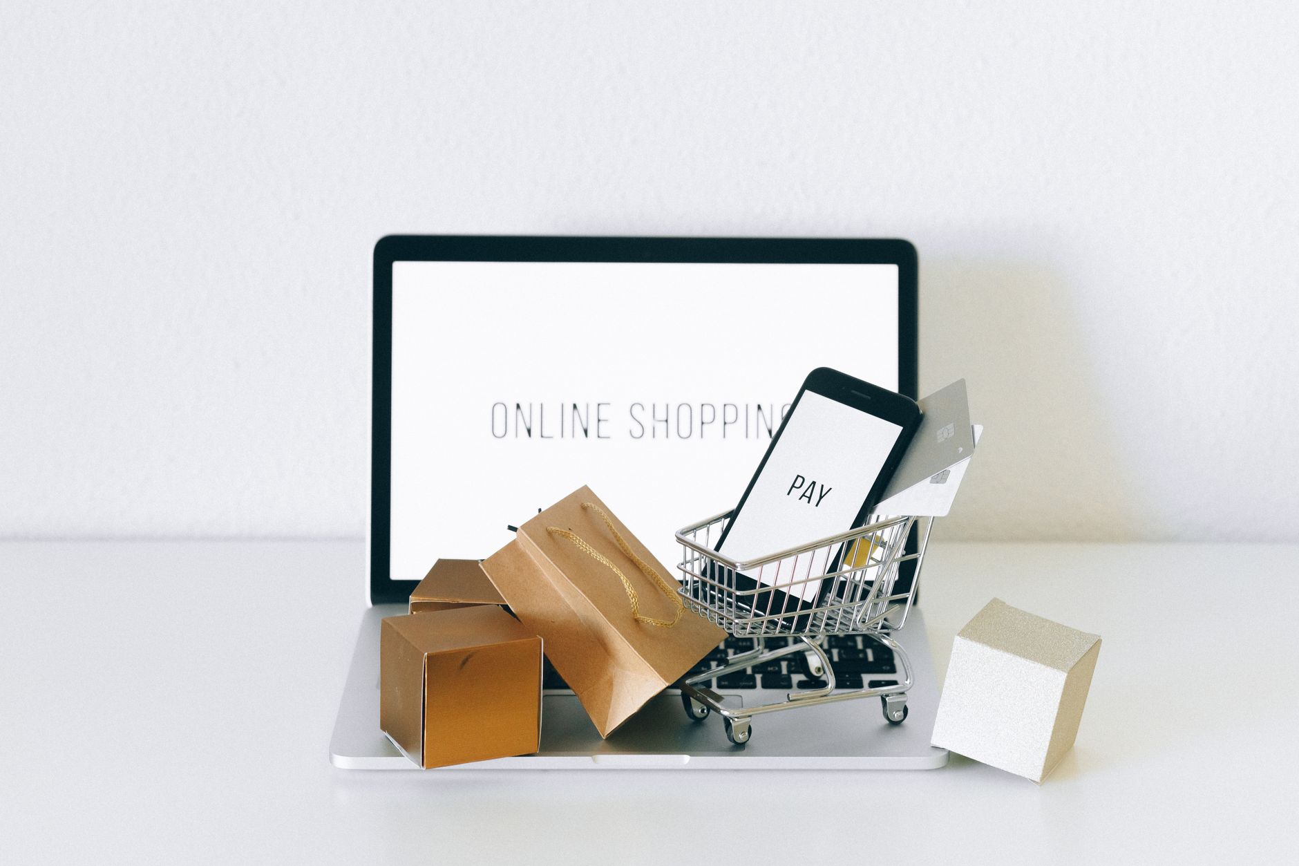 Online shopping cart and payment devices on laptop — ecommerce mobile commerce India