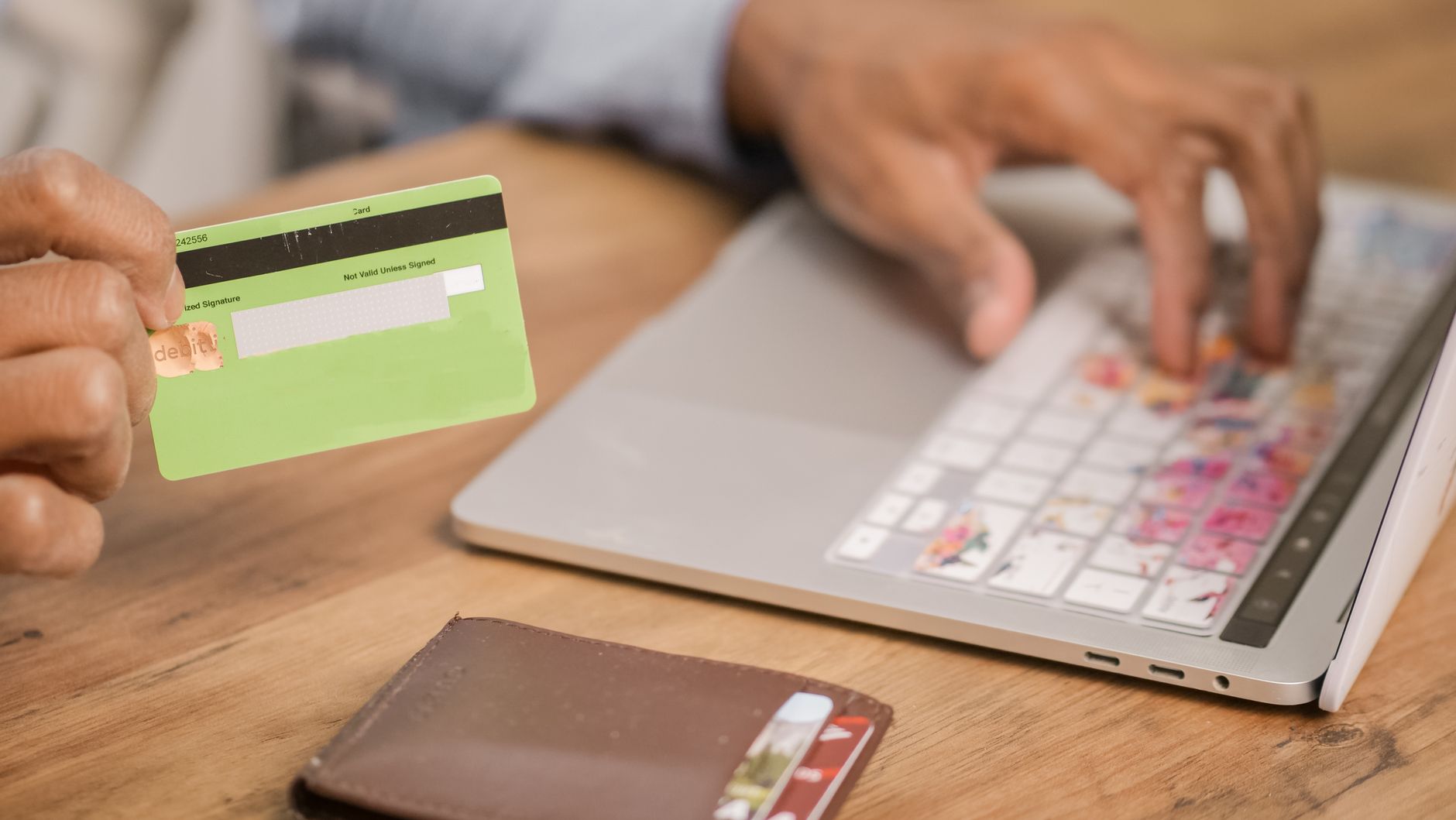 Person using credit card for online purchase representing ecommerce cross-selling strategy
