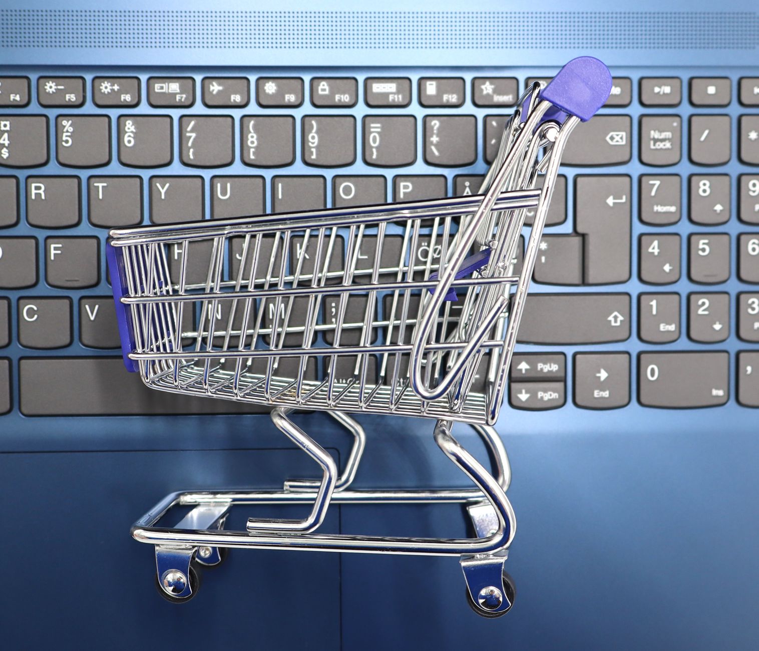 Shopping cart on laptop representing D2C online sales and repeat orders
