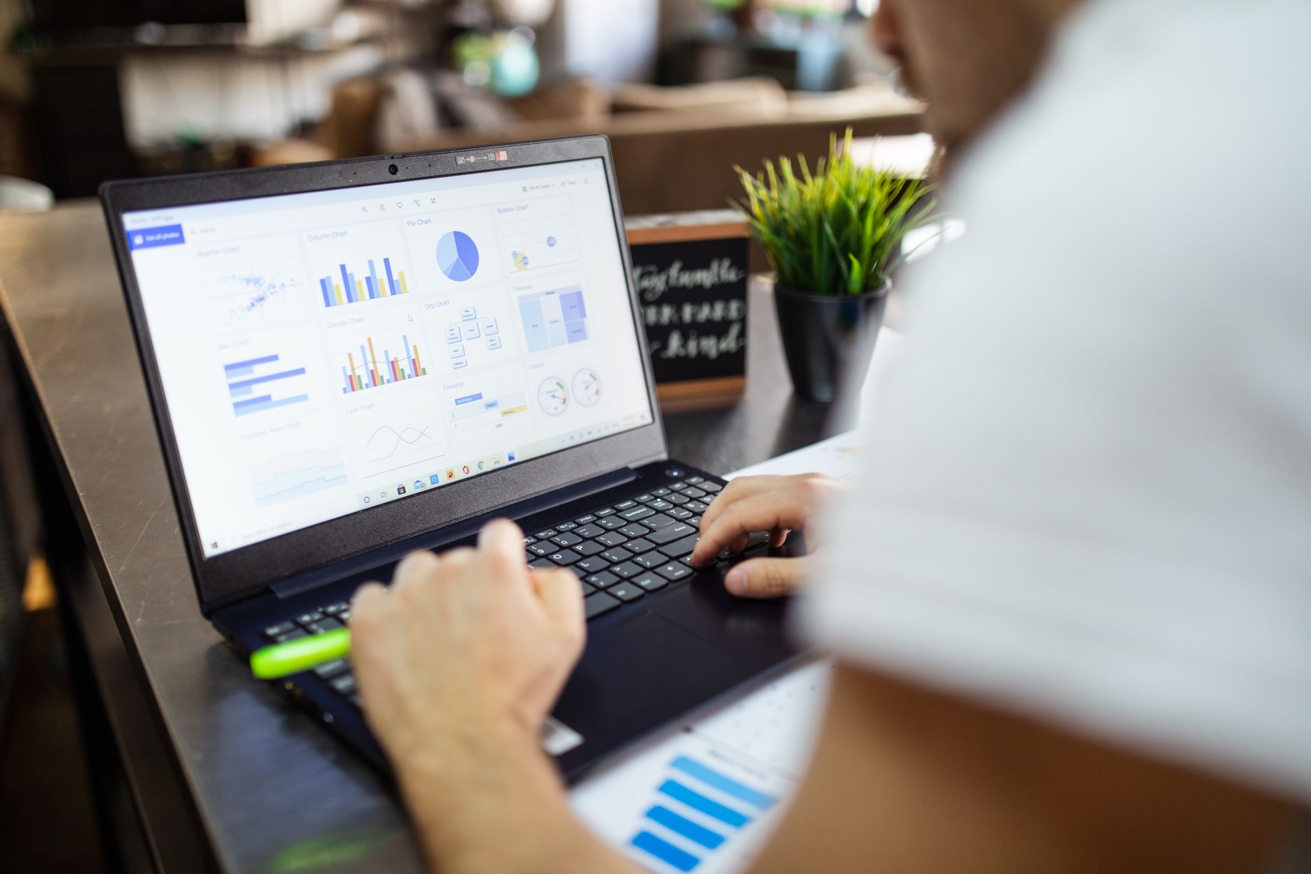 Business analyst reviewing Meta Ads performance charts on a laptop — ROAS optimization for DTC brands