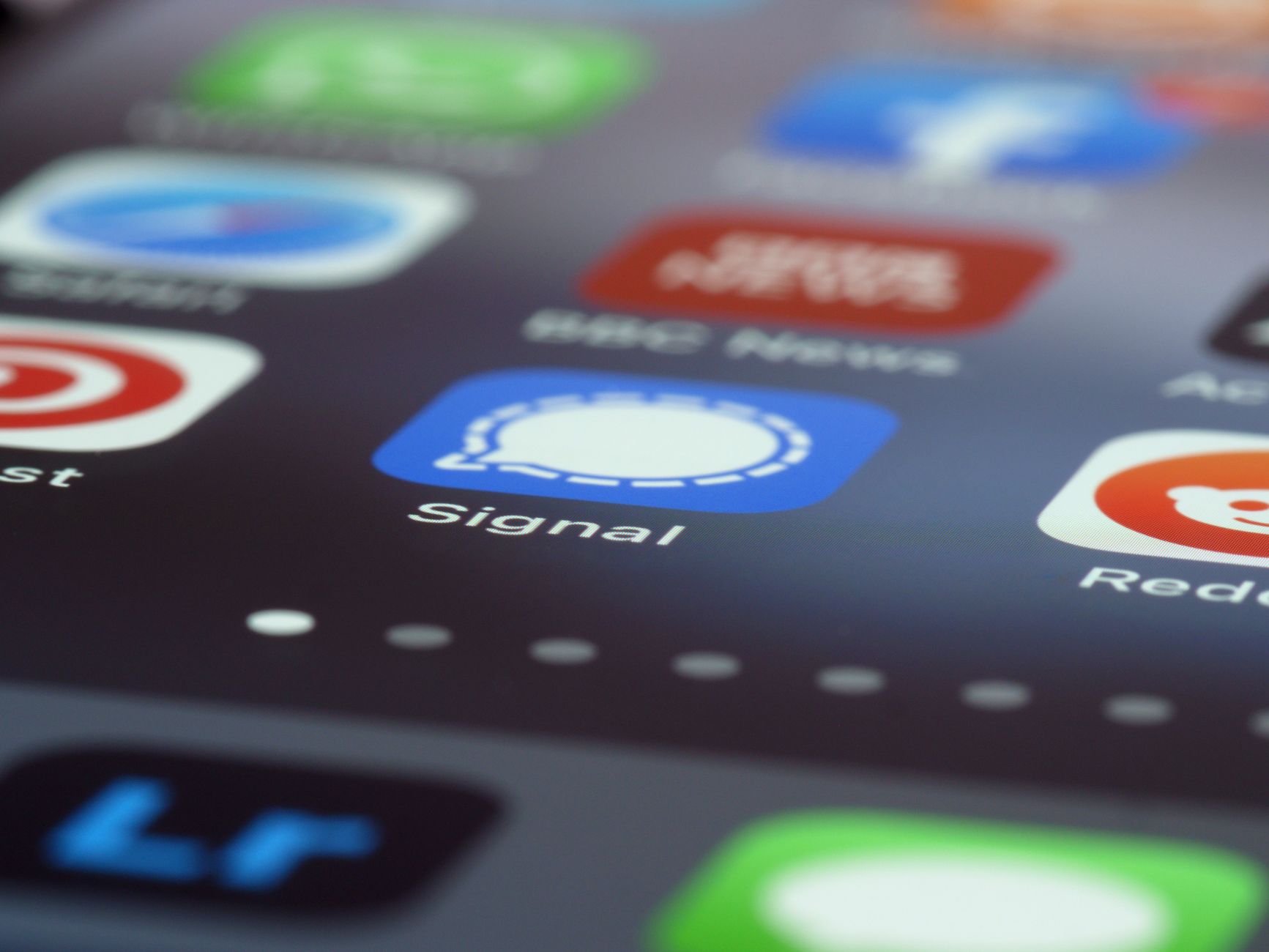 Smartphone screen with messaging app notifications illustrating SMS marketing reach for D2C brands