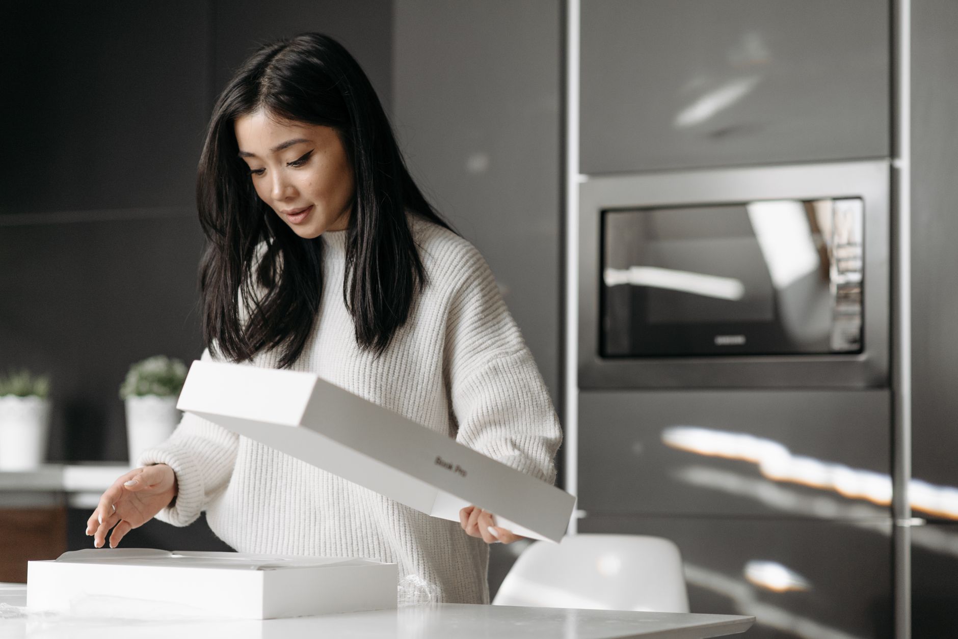 Customer unpacking a delivery box — post-purchase experience DTC brand