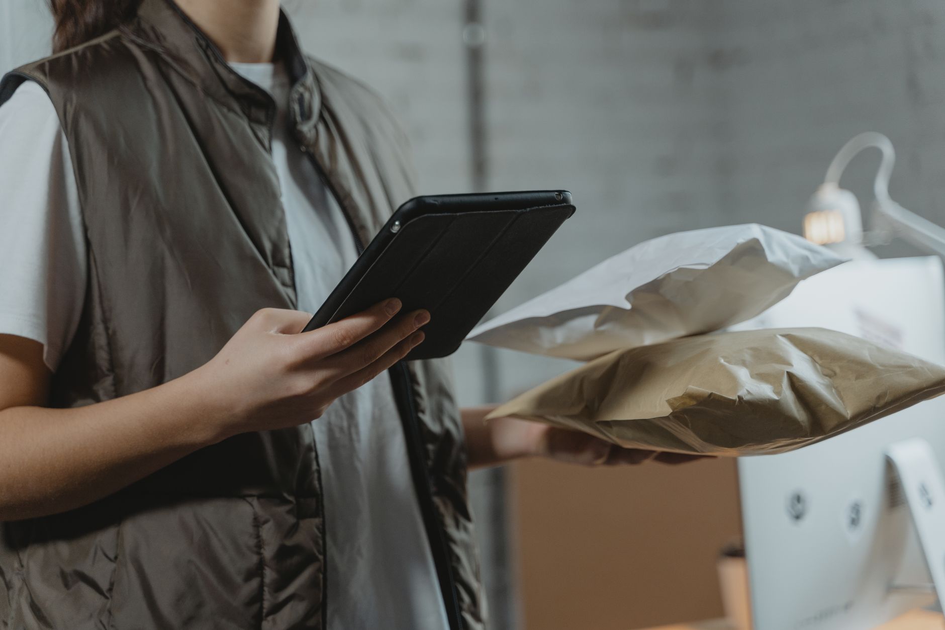 DTC brand owner managing customer orders and digital touchpoints on a tablet
